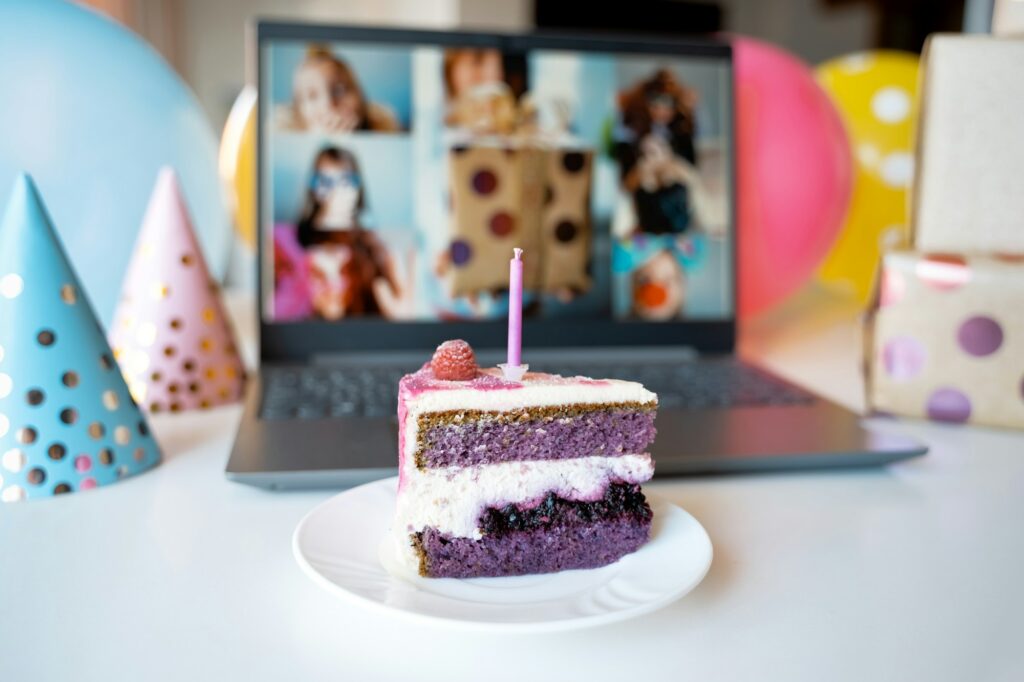 Kids virtual birthday,home party.Piece of cake with candle.Online conference,video call in laptop,co